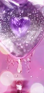 Purple heart crystal with shimmering water droplets on pink background.