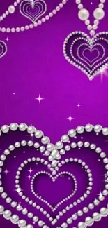 Elegant purple wallpaper with jeweled hearts covering the screen.