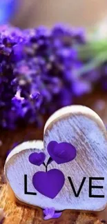 Purple heart with lavender flowers on a wooden background.