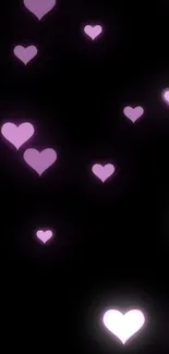 Purple heart shapes on a black background wallpaper.