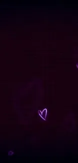 Neon hearts on a dark purple background creating a romantic aesthetic.