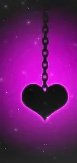 Black heart pendant on a glowing purple neon background.