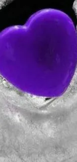 Vibrant purple heart on icy background.