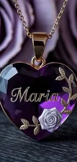 Purple heart pendant with floral design.