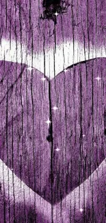 Purple heart on rustic wooden texture background.