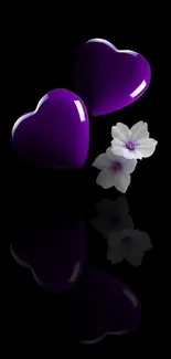 Purple hearts and white flower on black background wallpaper.