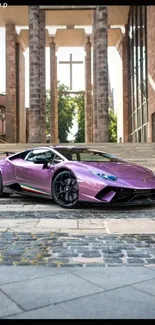 Purple luxury sports car parked elegantly in front of grand architecture.