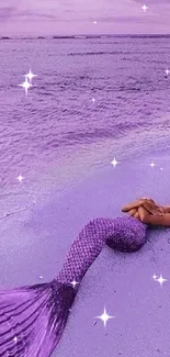 A mermaid with a purple tail resting on a tranquil purple beach at sunset.