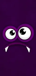 Whimsical purple monster wallpaper with cartoon eyes and playful expression.