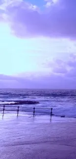 Serene purple ocean view at dusk with calming waters and clouds.