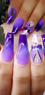 Elegant purple gradient nail art design with stylish and trendy elements.