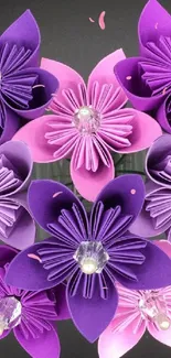 Mobile wallpaper of beautiful purple origami flowers on a dark background.