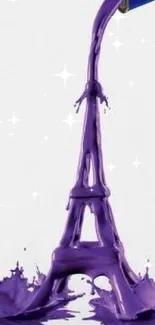 Purple paint forms Eiffel Tower on white background.