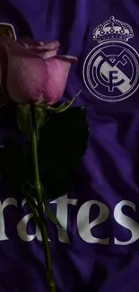 Purple rose on a sports logo shirt.