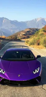 Purple sports car on scenic mountain road wallpaper.