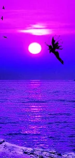 Mystical silhouette at purple ocean sunset wallpaper.