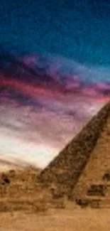 Dusk view of pyramid with vibrant sky.