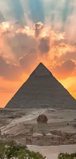 Pyramid with radiant sunset sky, casting shadows and vibrant colors.