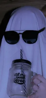 Ghost with sunglasses and a glass cup in dark lighting.