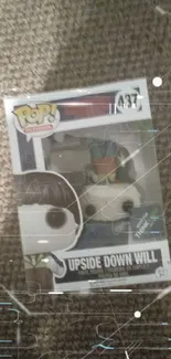 Boxed Pop figure with gray textured background.