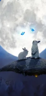 Two rabbits under a full moon with blue butterflies in a night scene.