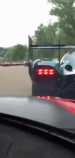 Race cars on a track at high speed.