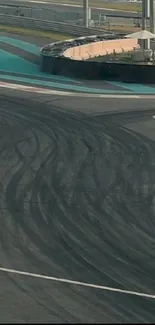 Dynamic racetrack curve with asphalt texture on mobile wallpaper.