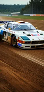 High-speed racing car on a dirt track kicking up dust.