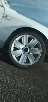 Close-up of a racing car wheel in motion.