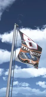 Racing car flag waves high against cloud-filled blue sky in dynamic wallpaper.