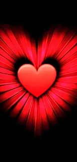 Vibrant red heart with radiant glow on black background.