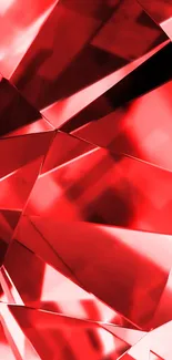 Red geometric crystal pattern wallpaper with vibrant facets.