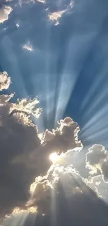 Sunlight streaming through clouds creating rays and a dramatic sky.