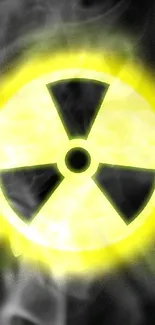 Glowing radiation symbol on a dark background.