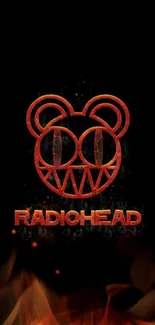 Radiohead red bear logo on black wallpaper.