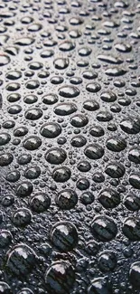 High-resolution rain droplets on a textured gray-blue surface.