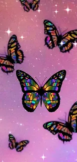 Colorful rainbow butterflies on a pink sparkling background.