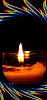 Candle with vibrant rainbow flames and dark backdrop.