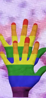 Colorful hands with rainbow stripes on a purple background.