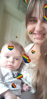 Happy mother and baby with rainbow hearts.