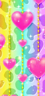 Vibrant pink hearts on rainbow gradient background mobile wallpaper.