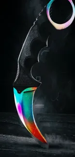 Rainbow karambit knife on a dark background.