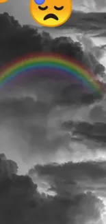 Mobile wallpaper with rainbow over cloudy sky and sad emoji.