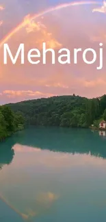 Rainbow over tranquil lake with forested backdrop.