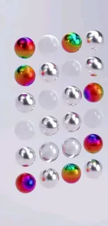 Colorful rainbow spheres with metallic finish on a silver background.