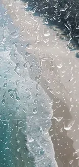 Raindrop-covered glass with beach view.