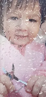 Baby with raindrop effect on mobile wallpaper.