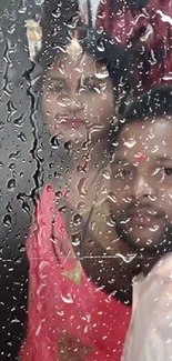 Couple behind raindrop-covered glass, creating a serene and romantic wallpaper.