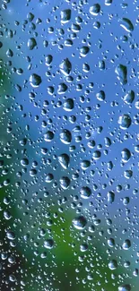 Raindrop-covered glass with blue sky background, creating a serene mobile wallpaper.