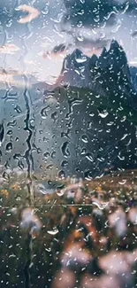 Mountain view through rain-covered window wallpaper.